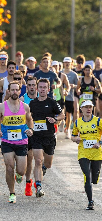 Runners starting the half marathon, running off in a group