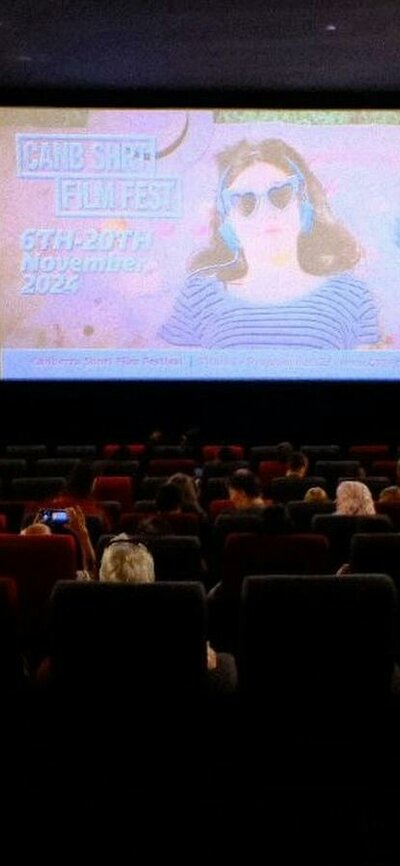 CSFF screening with audience watching Screening of a CSFF Film in a Cinema with screen in the background and the audience in foreground
