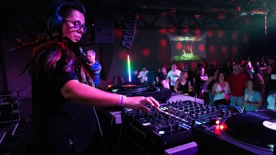 DJ YAYA at the One Night in HEaven Fundraiser SpringOUT 2024 Femail DJ YAYA playing music at The VAULT