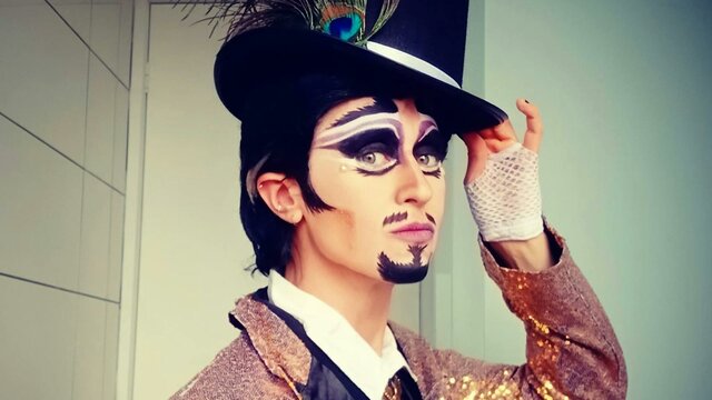 Guy Alias performing at SpringOUT Drag King with tophat