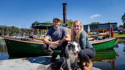 The owners of traditional boats can be as fascinating as the boats themselves Steam Launch Belle with owners Adam, Antonia and the ship's dog