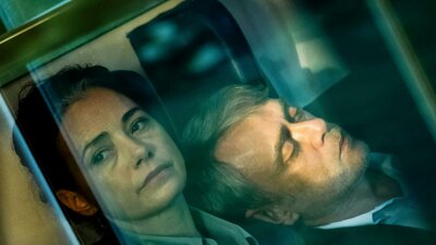Yellow Letters | Gelbe Briefe, screening Sat, Oct 24, 2026 Hazy photo of woman looking morose past the camera and a man leaning on her shoulder