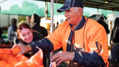 Auddino's Produce at Capital Region Farmers Market Citrus producer selling oranges at farmers market