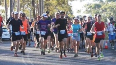 Runners in a bush setting