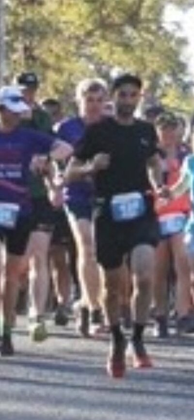 Runners in a bush setting