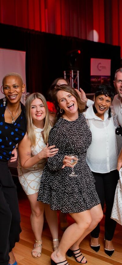 CAPO Art Auction 2019 Group of people at an event looking happy getting their photo taken