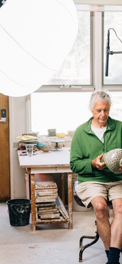 Ceramicist Malcolm Cooke being interviewed in his studio