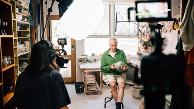 Ceramicist Malcolm Cooke being interviewed in his studio