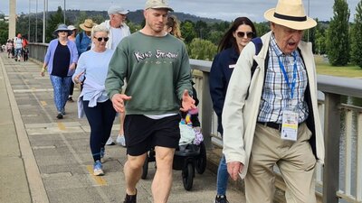 a group of people of various ages walking