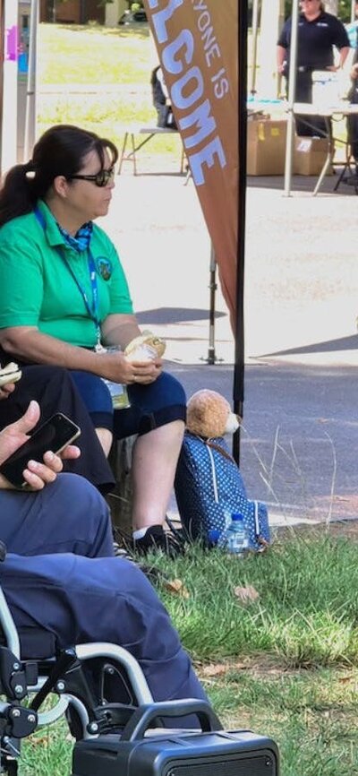 a man in a wheelchair with a microphone