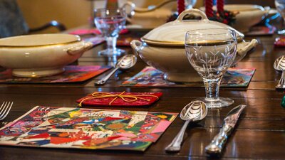 Historical Christmas objects laid out on dining table at Calthorpes House