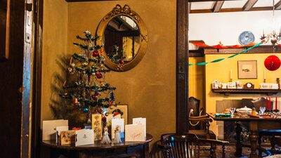 Christmas tree display with dining room in background at Calthorpes House