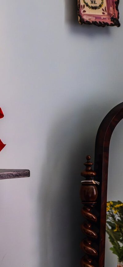 Christmas candle and small sculpture in bedroom at Lanyon Homestead