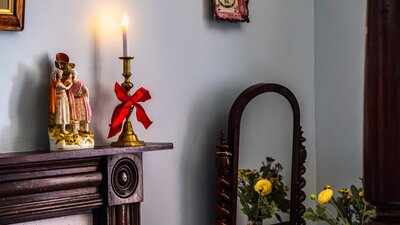 Christmas candle and small sculpture in bedroom at Lanyon Homestead