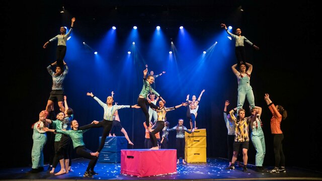 Youth performers from Warehouse Circus will be performing in Canberra City A group of young acrobats in a tableau of acrobatic forms