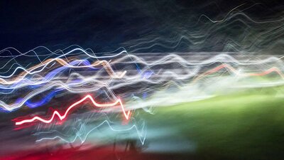 a long exposure image of moving lights