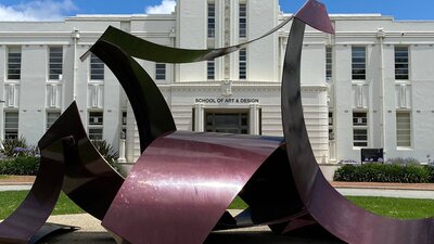 ANU School of Art and Design meets a tori A giant metal sculpture called Tori, in front of the art deco ANU School of Art and Design