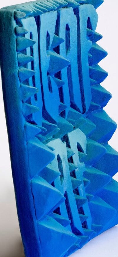 Side view of textured ceramic artwork by Kirsty Collins.