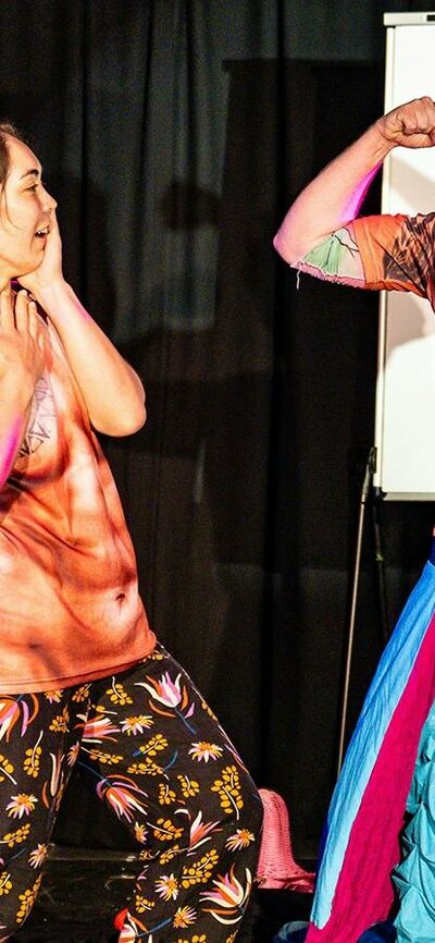 Fringe World Perth Season Photo Sean Breadsell Woman laughing at man flexing wearing a muscle tshirt