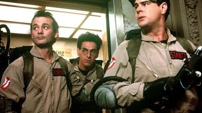 Still from Ghostbusters showing a group of men in overalls with equipment