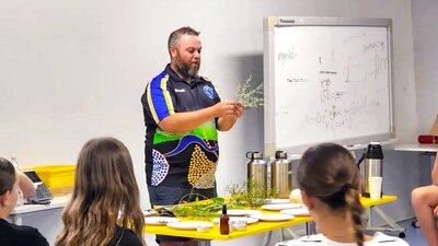 Wiradjuri man Adam Shipp presents to a classroom style audience