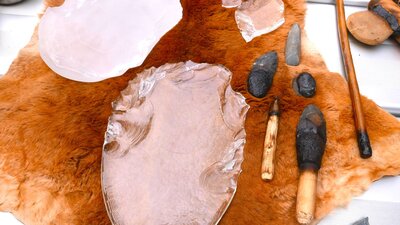 Cultural Masterclass with Aidan Hartshorn and Shane Herrington at Canberra Glassworks Glass objects and cultural tools on a fur pelt