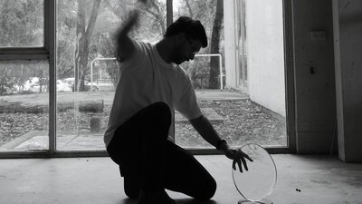 Artist knapping glass