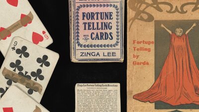 Playing cards pictured alongside their packaging