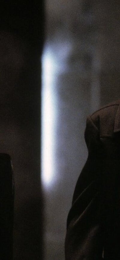 The Matrix (1999) Man and woman standing dressed in black wearing black sunglasses