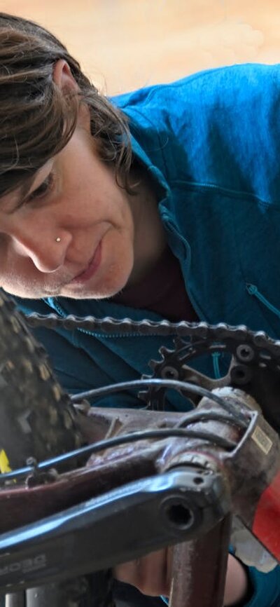 Cyclist checking her bike