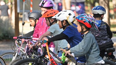 A group of bys with bicycles