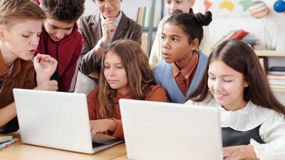 Children working together to code an app
