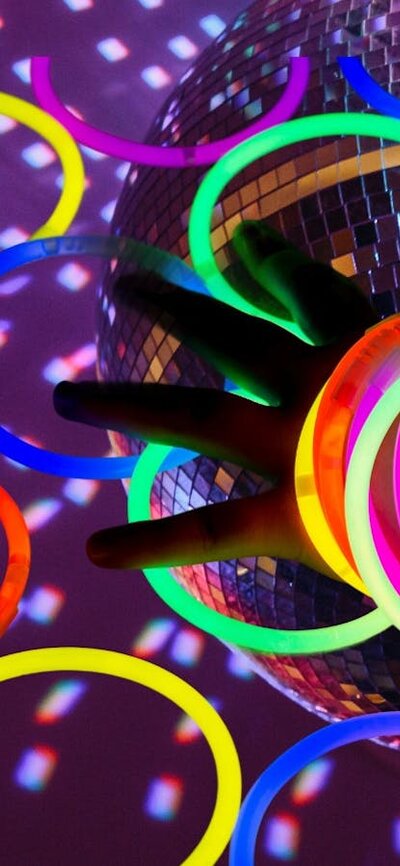 Disco ball with arm and glow sticks