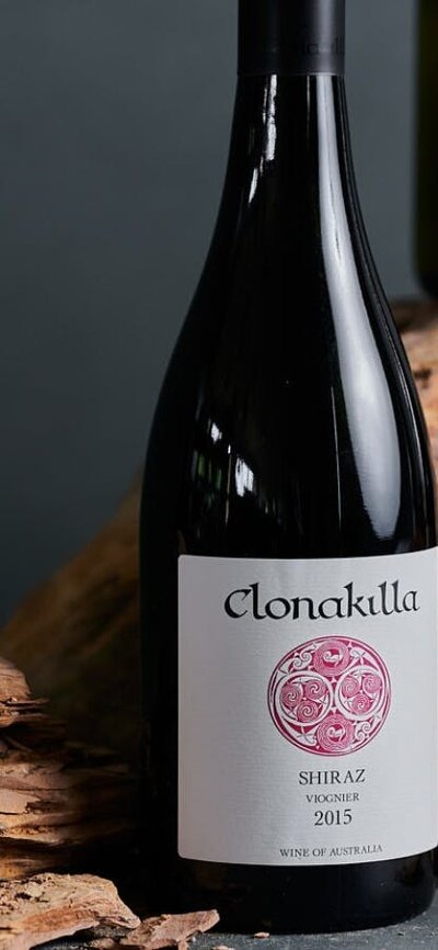 Bottles of wine next to Canberra soil