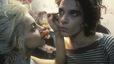 Dogs in Space + Q&A Woman applies eyeliner on man's bottom line