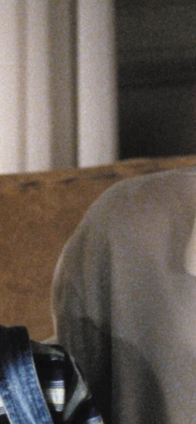 Double Feature: Run Lola Run + Funny Games Man wearing a white polo next to a figure with a white pillowcase on their head
