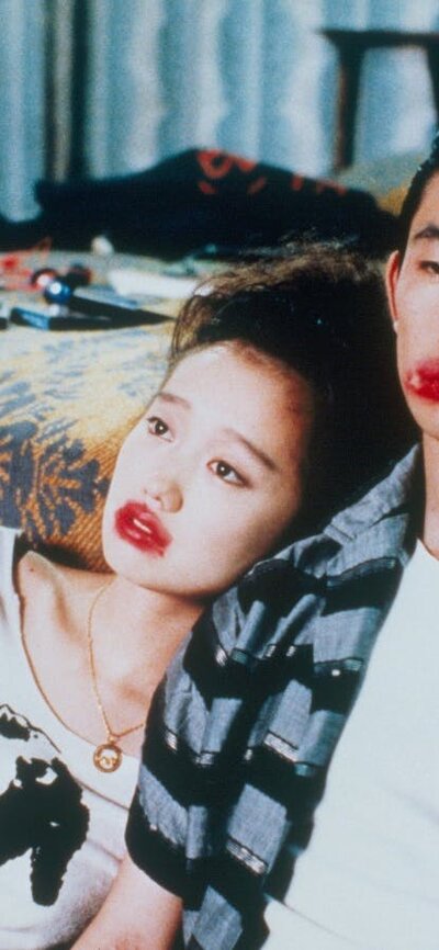 Double Feature: Mystery Train + Night on Earth, 28 August, 2026 A couple looking exhausted leaning on a bed sitting on floor, both wearing red lipstick