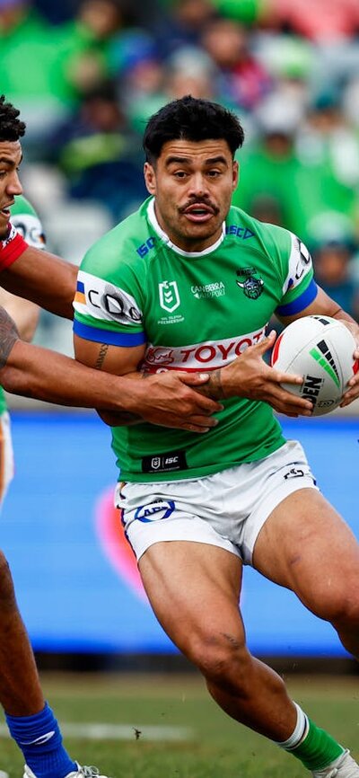 Canberra Raiders player Matthew Timoko running the ball,
