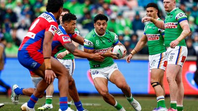 Canberra Raiders player Matthew Timoko running the ball,