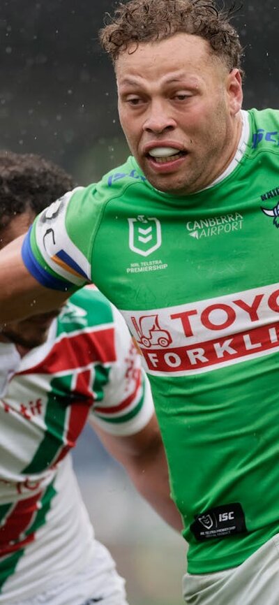 Canberra Raiders player Sebastian Kris running the ball.