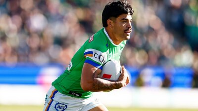 Canberra Raiders player Matthew Timoko running the ball.