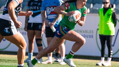 Canberra Raiders player Madison Bartlett running the ball.
