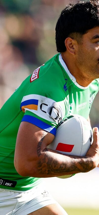 Canberra Raiders player Matthew Timoko running the ball.