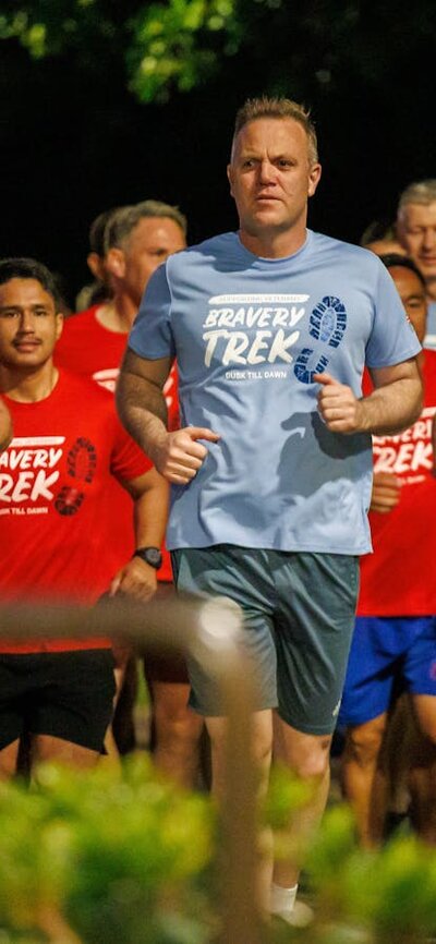 Group of people running in Dusk till Dawn tshirts
