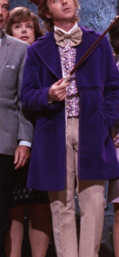 Group of adults and children all looking curious towards the side