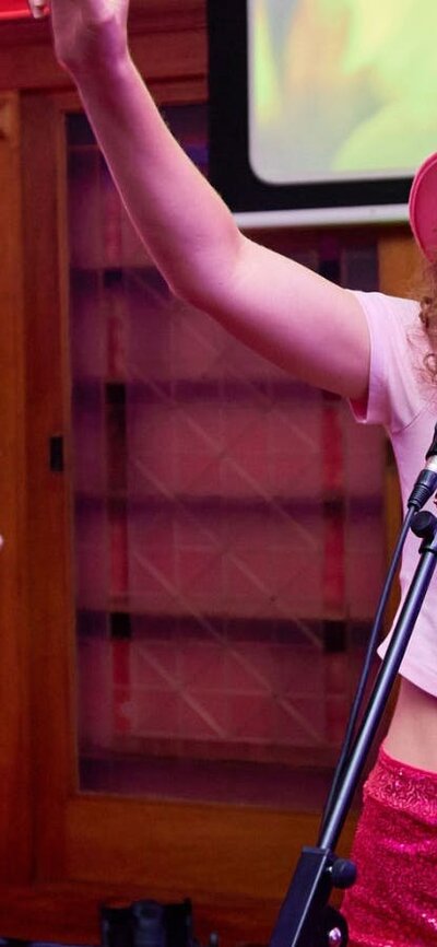 Two girls singing karaoke in Old Parliament House