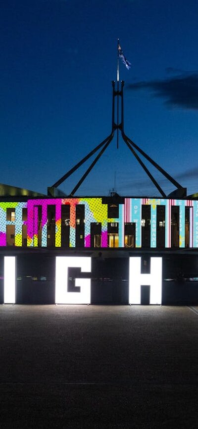 Enlighten letters displayed in front of Parliament House