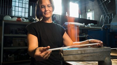 Neon Glass Artist bending glass