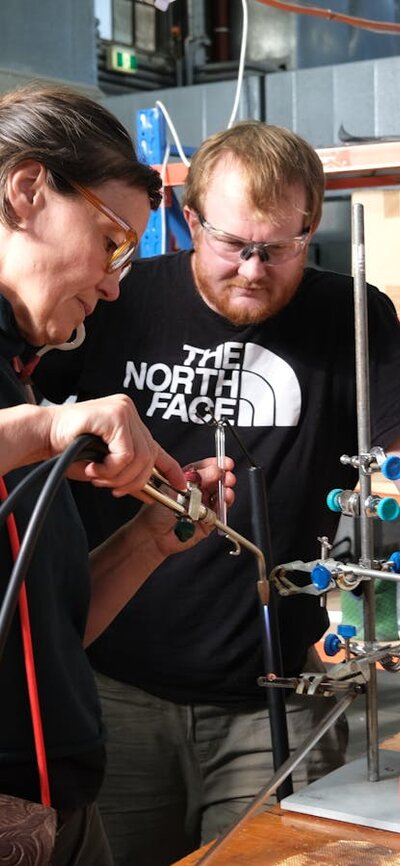 Artist bending NEON glass