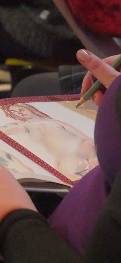 Photo of people creating life drawings